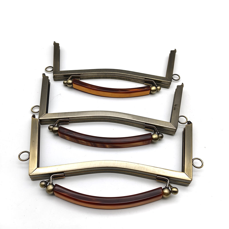 Exquisted customized hanging brush anti brass round ball kiss lock resin handle purse bag metal frame 21CM